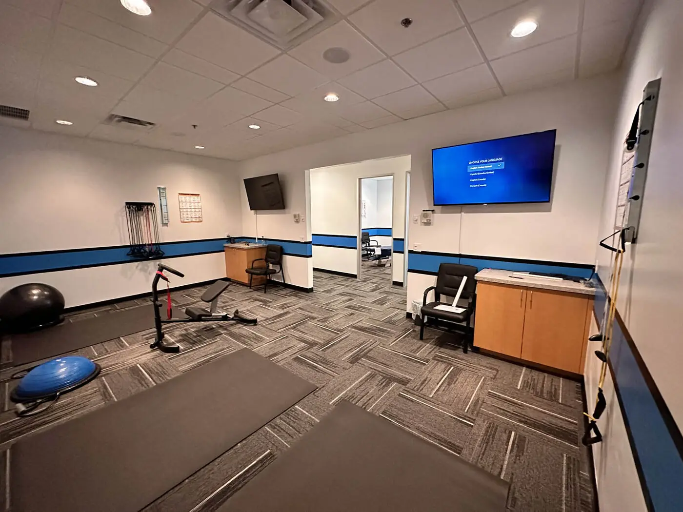 KTK Chiropractic rehab room with therapy mats and exercise equipment